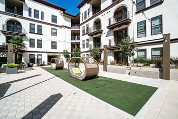 Central courtyard with bbqs, fireplace, outdoor kitchen and green space for recreation